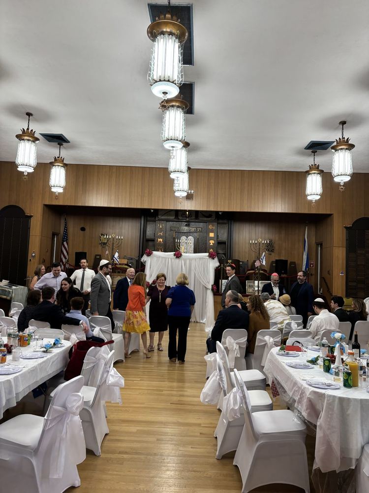 Gathering at the kiddush buffet
